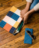 cobalt blue glasses case with matching checkered laptop case