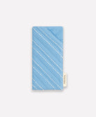 blue glasses case with white hand-stitched embroidery