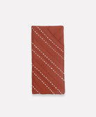 rust red glasses case with white hand-stitched embroidery