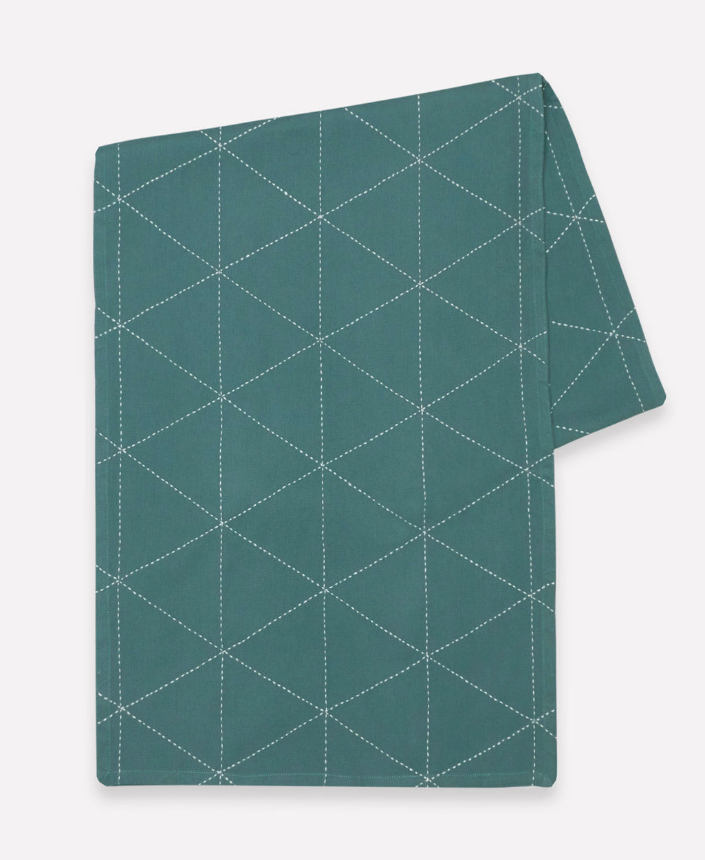 spruce green table runner with white embroidered triangle stitching