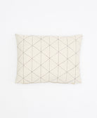 Quilted pillow with diamond pattern on a white background