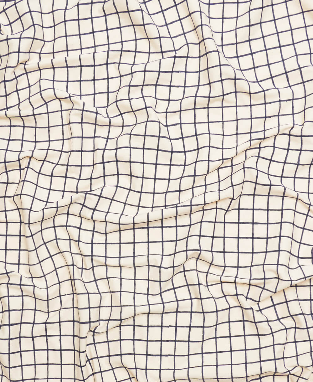 small grid patterned organic cotton table cloth in navy and white