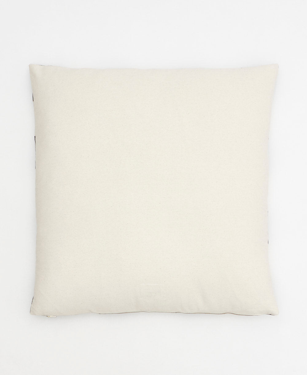 back of spruce green interlock throw pillow in solid natural white
