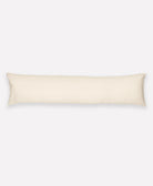 Beige body pillow on a white background