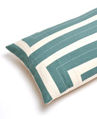 spruce green and white striped pillow on a white background