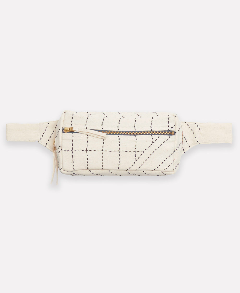 white crossbody belt bag with black embroidery and two zippered compartments