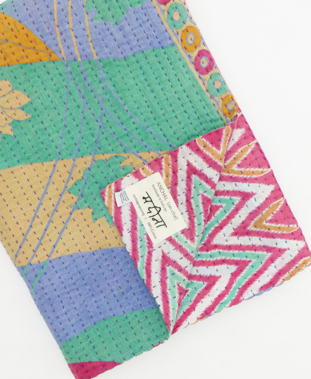 Kantha quilt throw featuring traditional kantha hand stitching