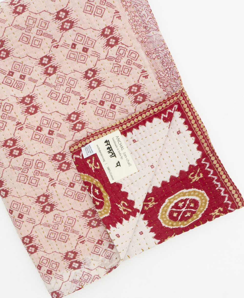 Kantha quilt throw featuring traditional kantha hand stitching