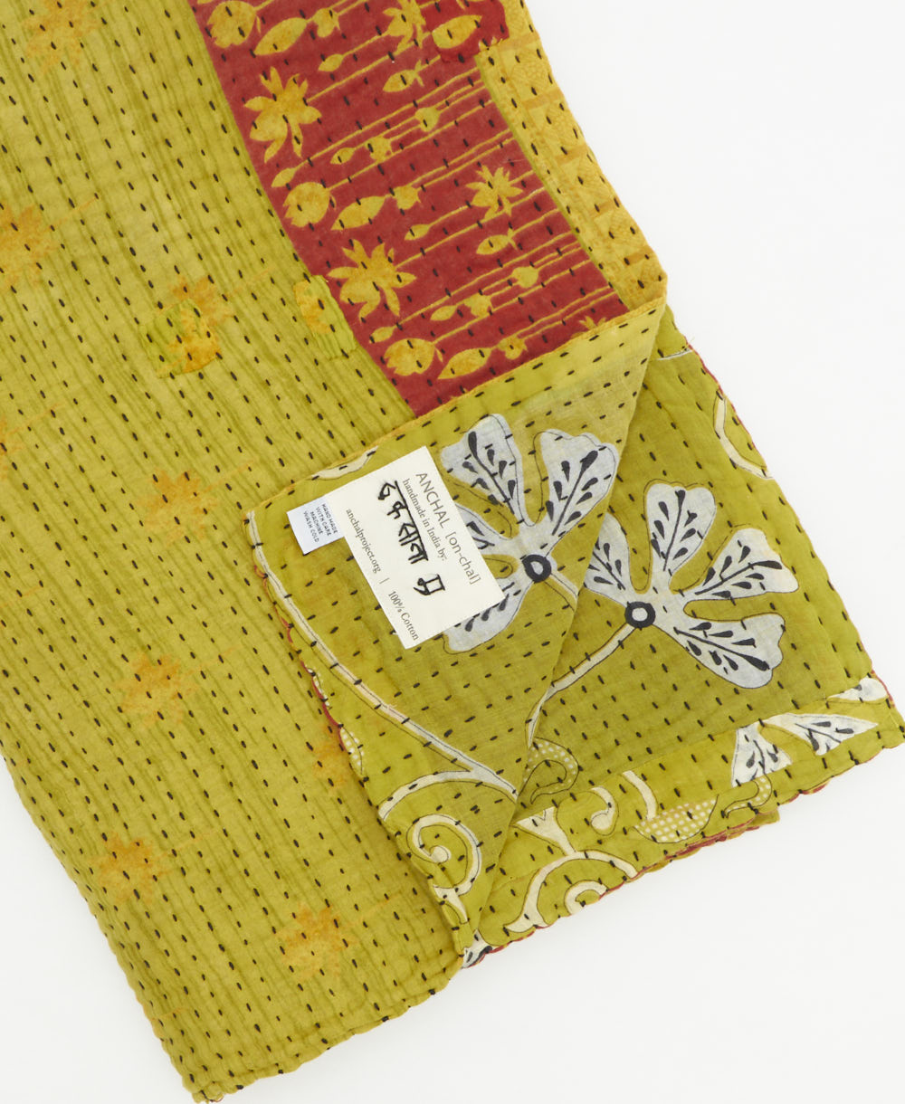 Kantha quilt throw featuring traditional kantha hand stitching