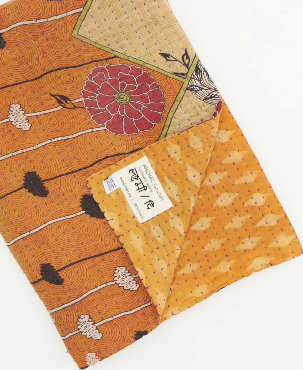Kantha quilt throw featuring traditional kantha hand stitching