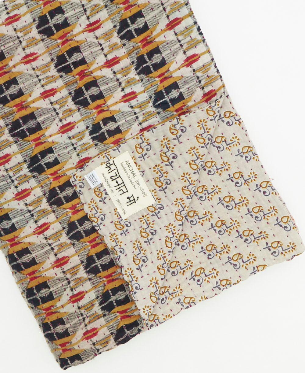 Kantha quilt throw featuring traditional kantha hand stitching