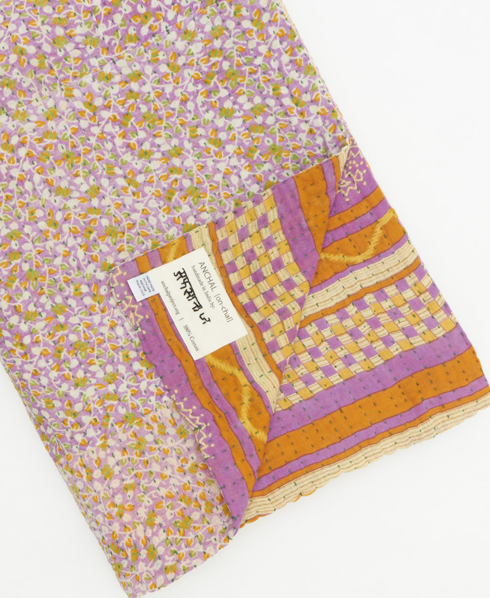 Kantha quilt throw featuring traditional kantha hand stitching