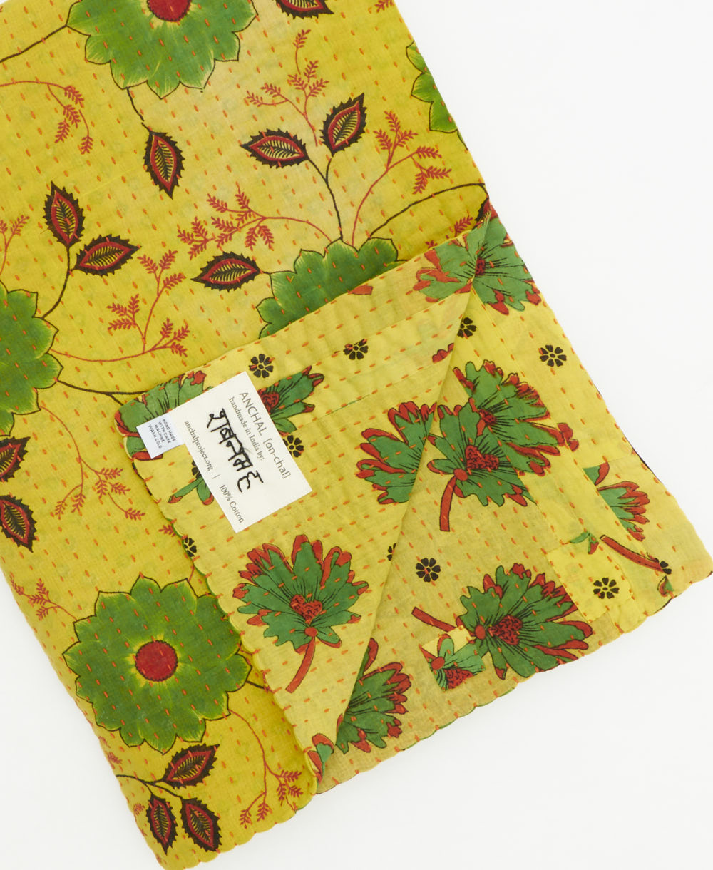 Kantha quilt throw featuring traditional kantha hand stitching