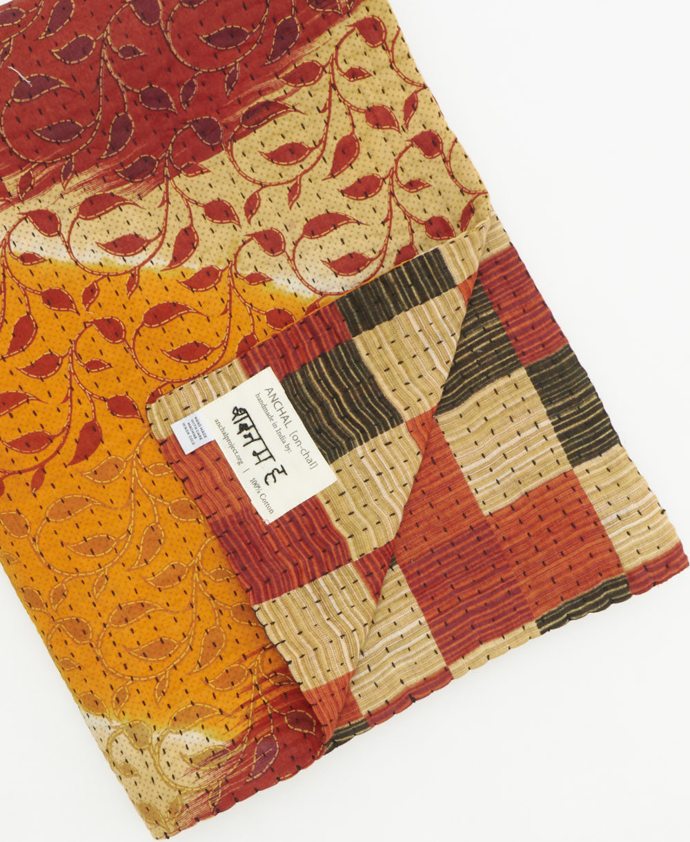 Kantha quilt throw featuring traditional kantha hand stitching