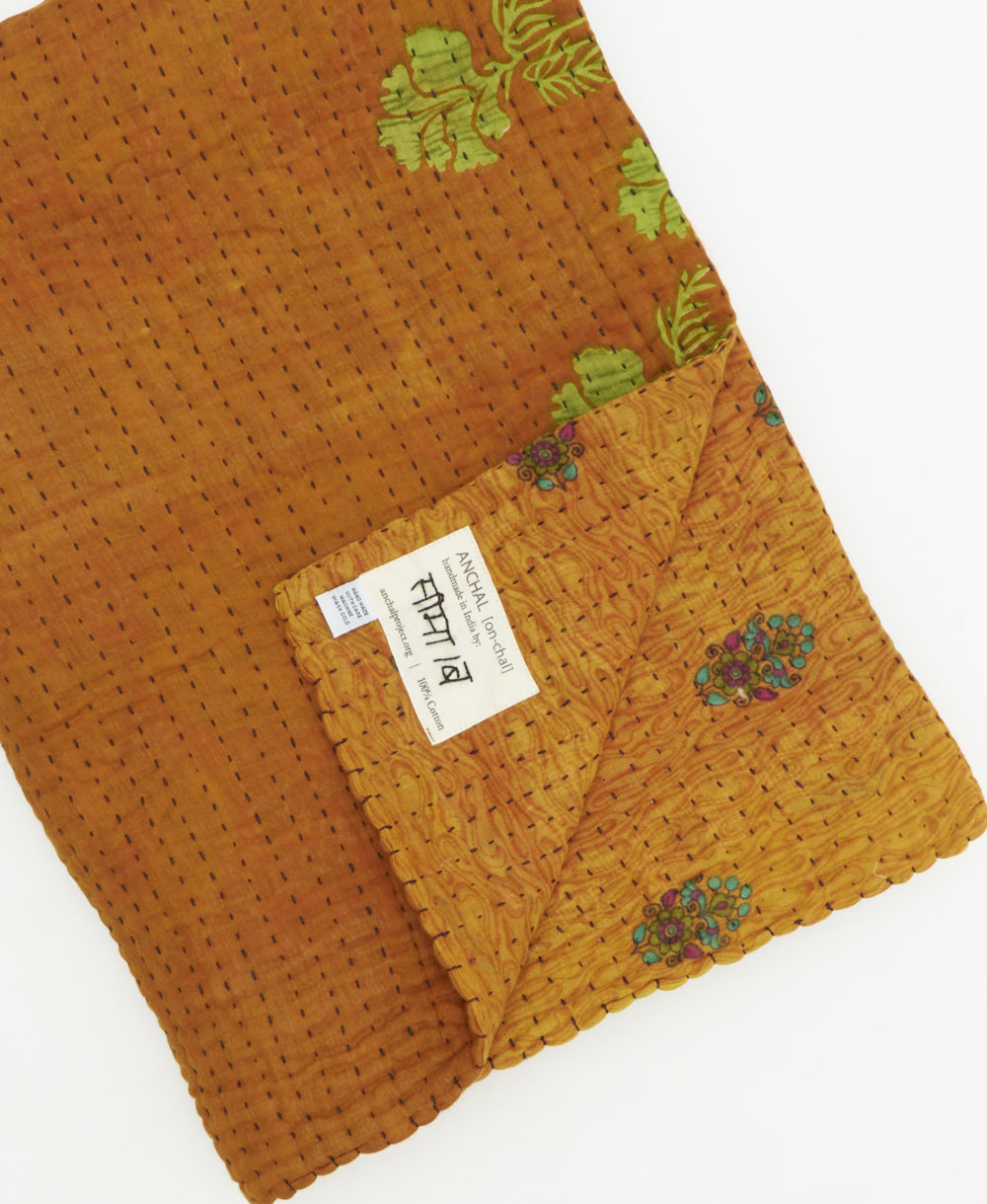 Kantha quilt throw featuring traditional kantha hand stitching