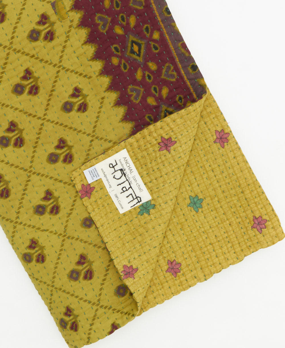 Kantha quilt throw featuring traditional kantha hand stitching