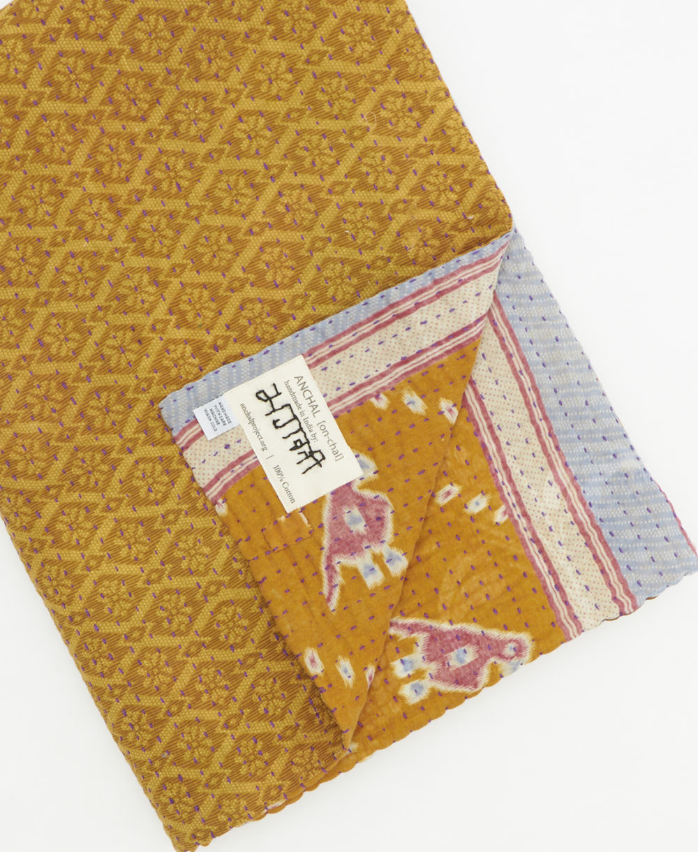 Kantha quilt throw featuring traditional kantha hand stitching