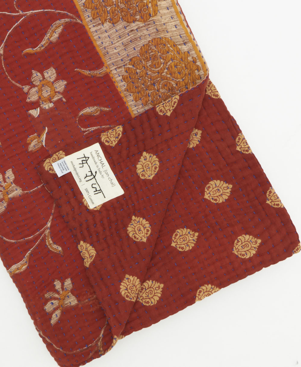 Kantha quilt throw featuring traditional kantha hand stitching