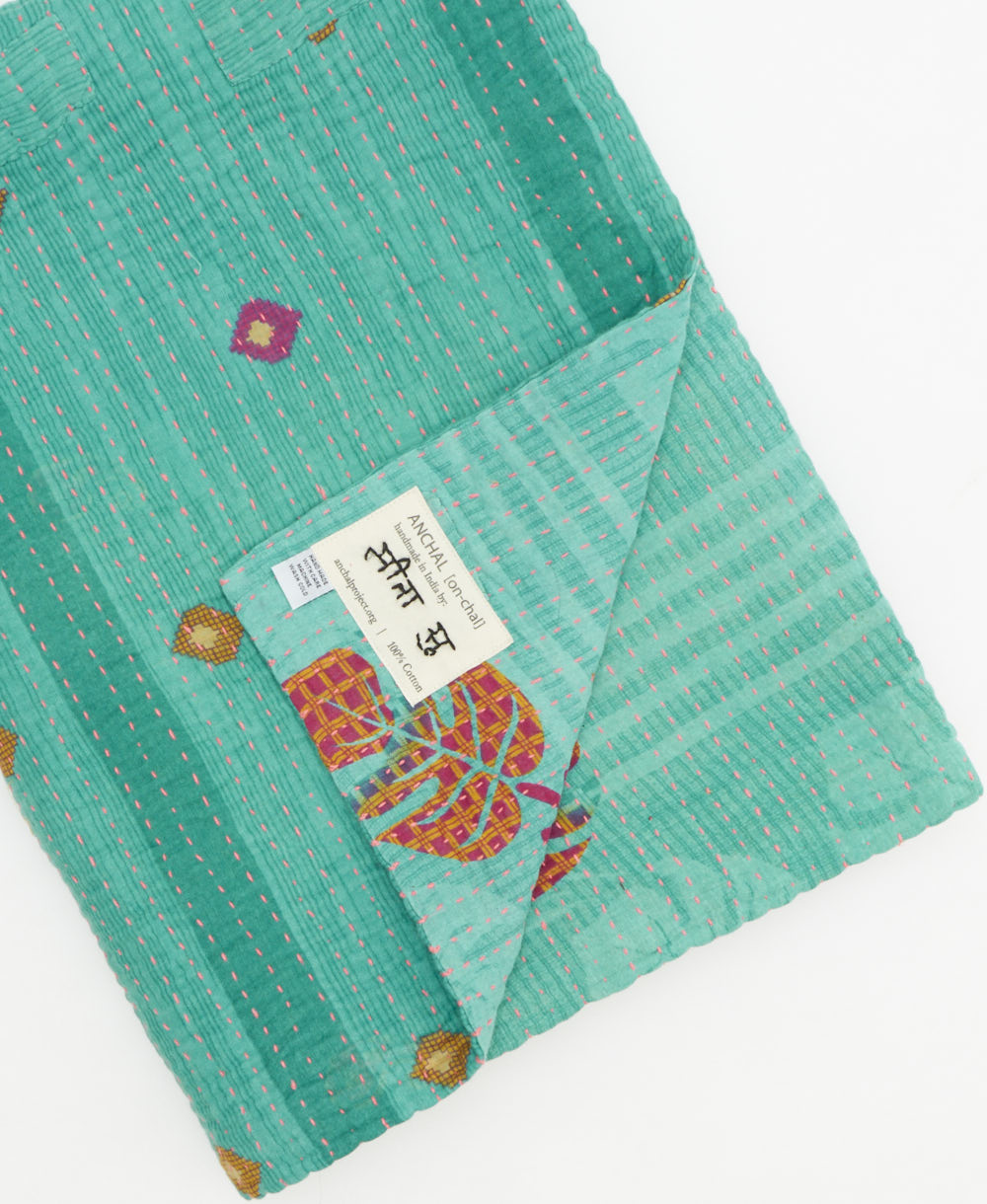 Kantha quilt throw featuring traditional kantha hand stitching