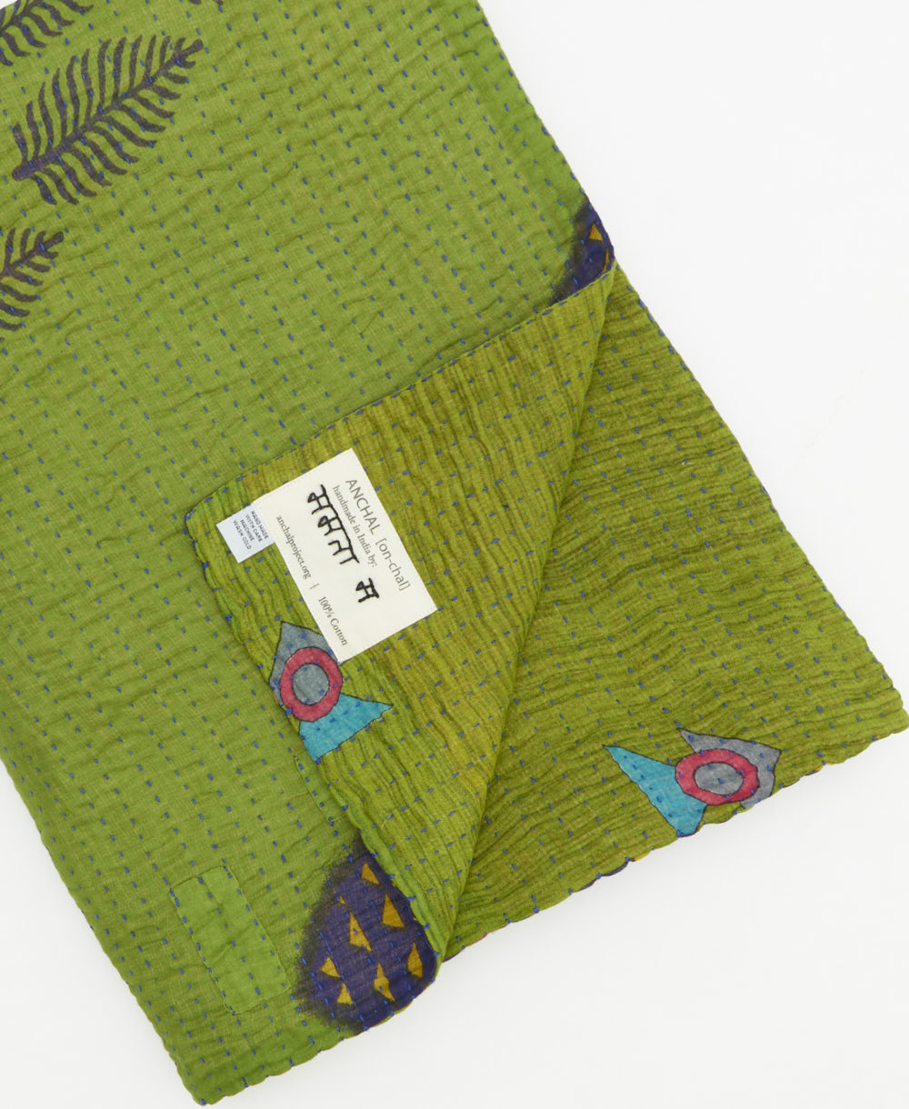 Kantha quilt throw featuring traditional kantha hand stitching