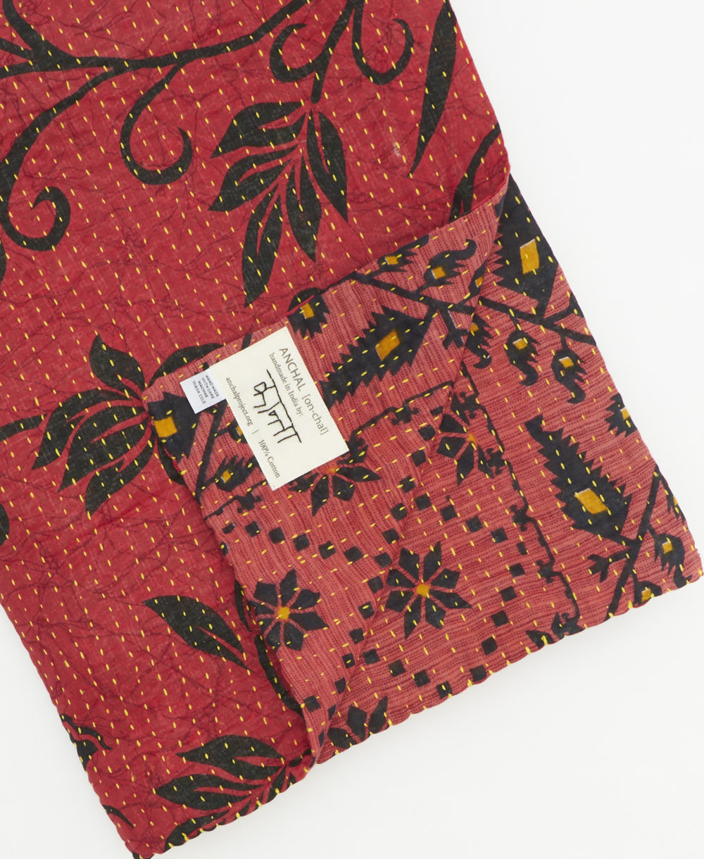 Kantha quilt throw featuring traditional kantha hand stitching