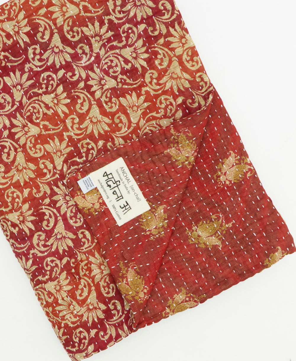Kantha quilt throw featuring traditional kantha hand stitching