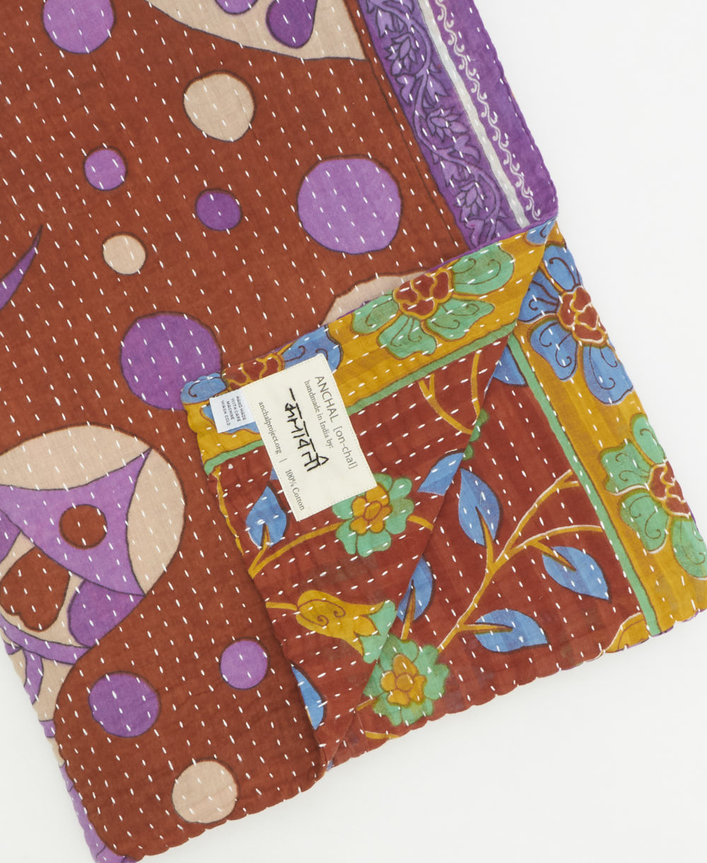 Kantha quilt throw featuring traditional kantha hand stitching