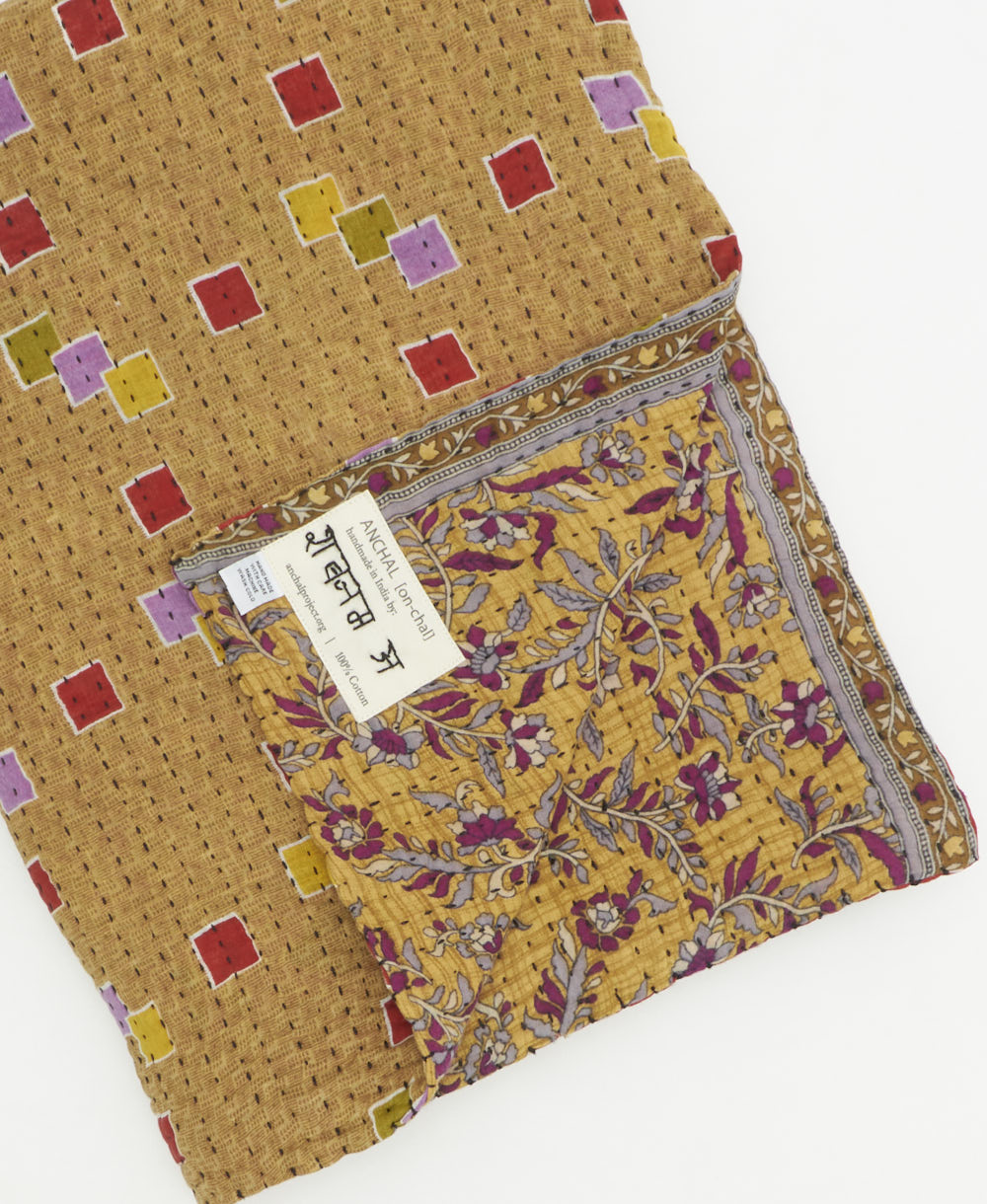 Kantha quilt throw featuring traditional kantha hand stitching