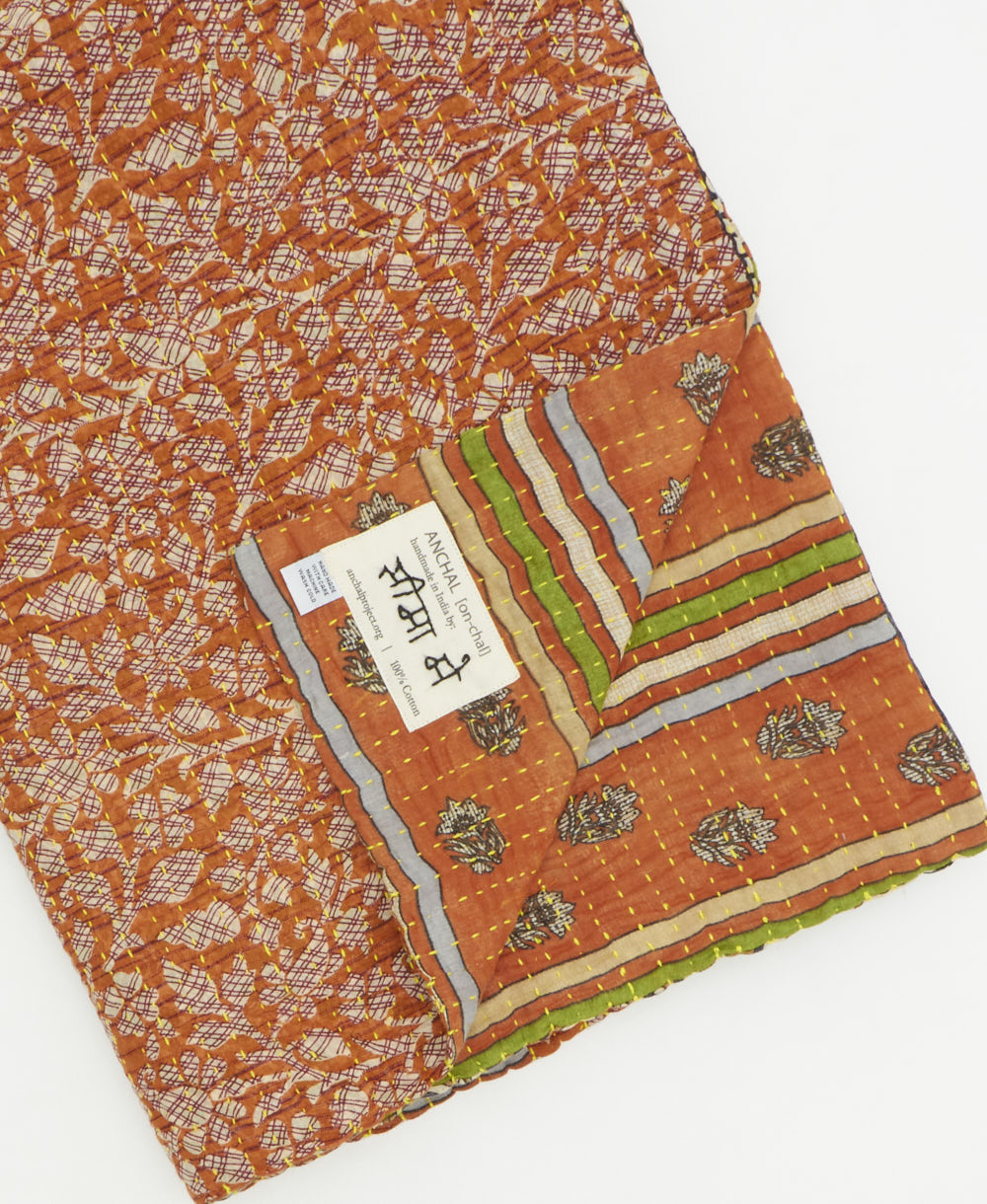 Kantha quilt throw featuring traditional kantha hand stitching