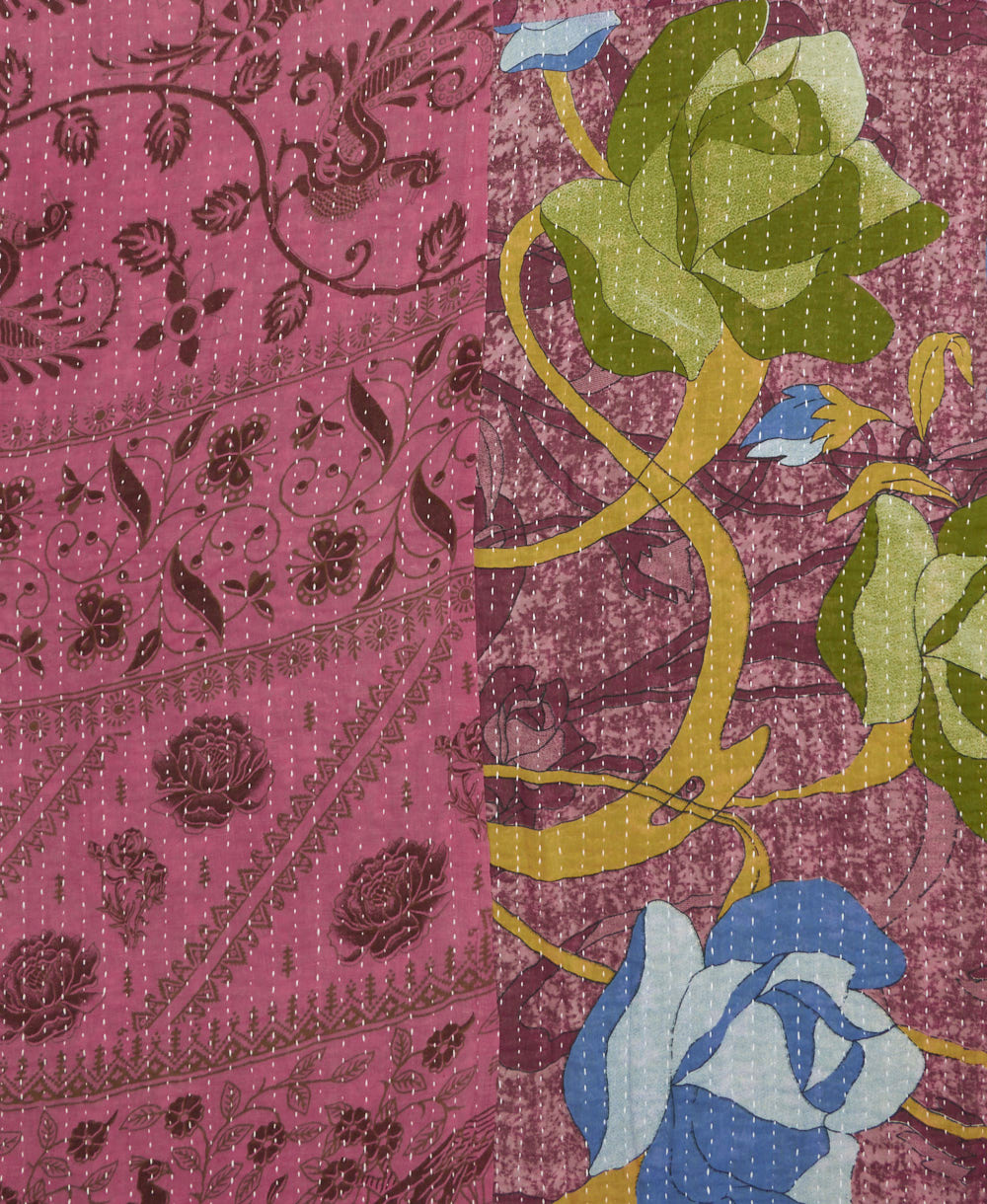 kantha quilt throw with a tag featuring the hand-stitched signature of the maker