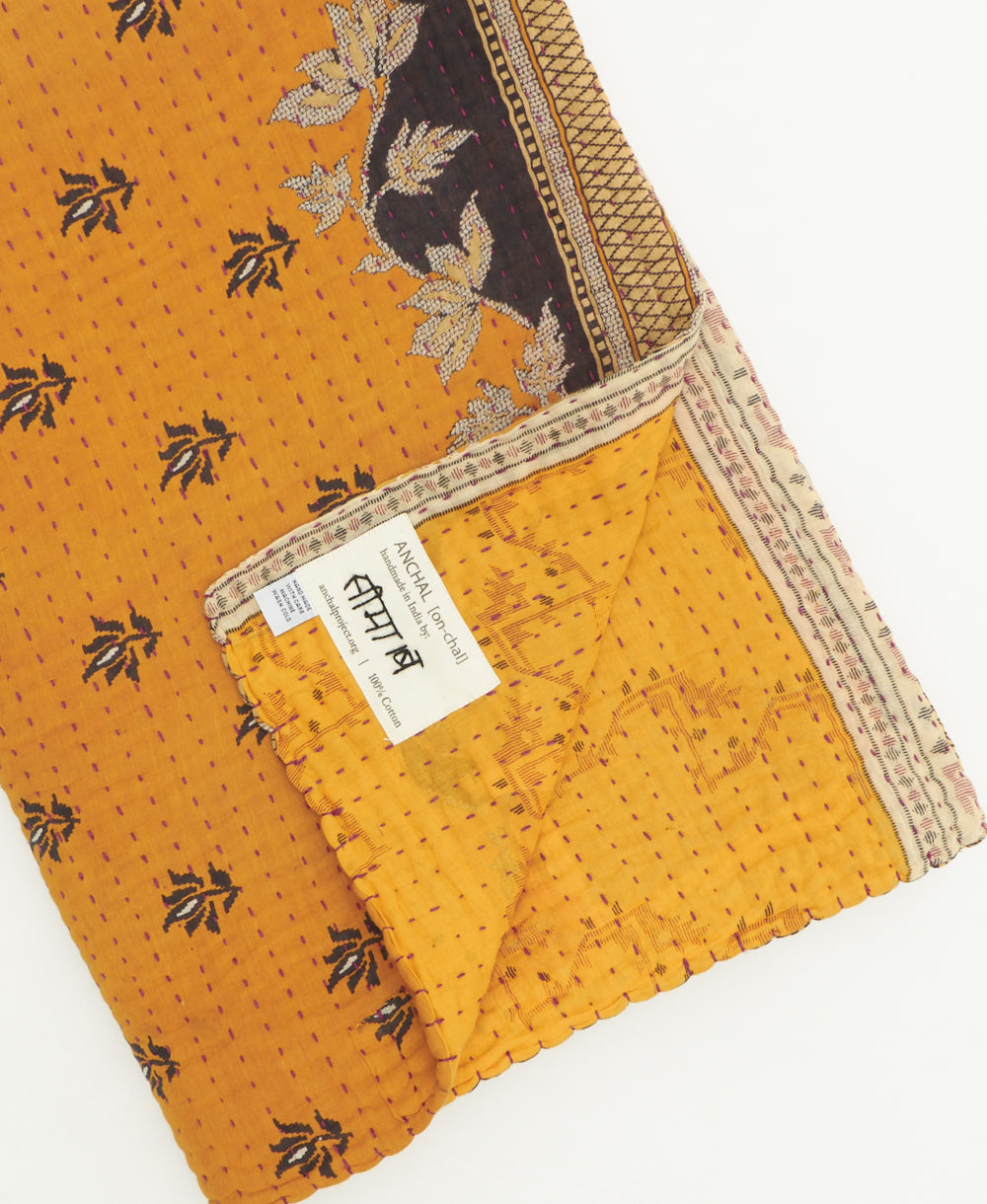 kantha quilt throw featuring traditional kantha hand stitching