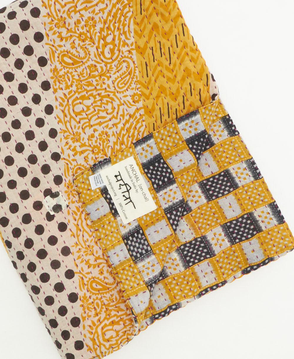 kantha quilt throw featuring traditional kantha hand stitching