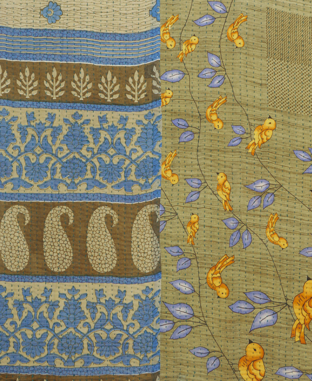 kantha quilt throw with a tag featuring the hand-stitched signature of the maker