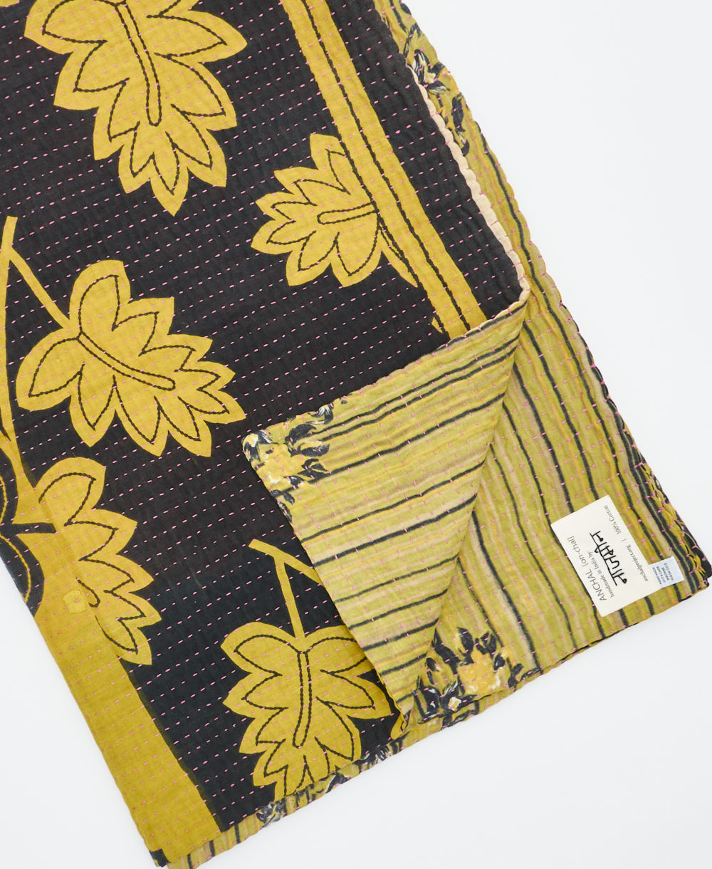 Kantha quilt throw featuring traditional kantha hand stitching