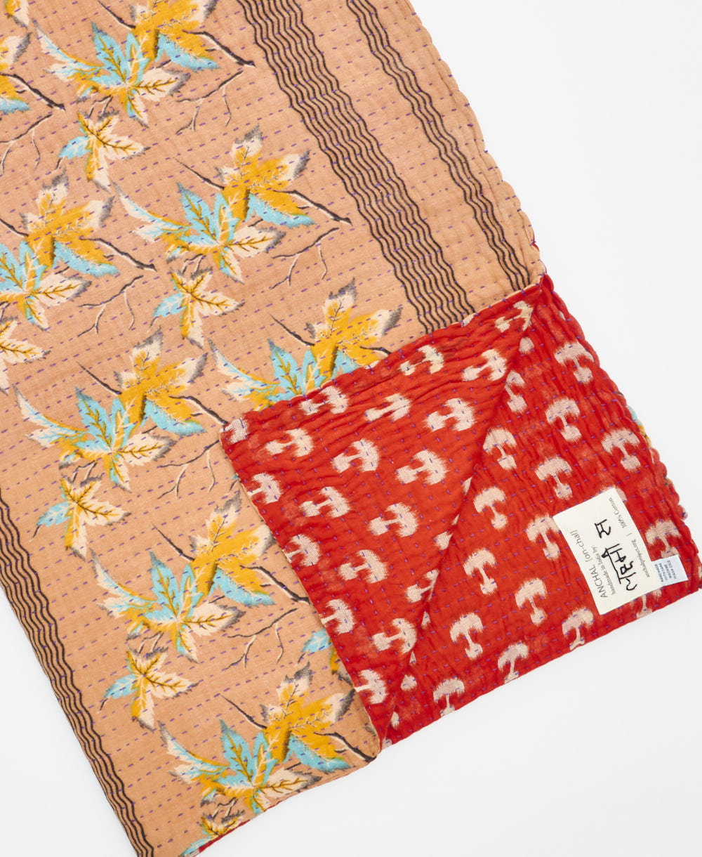Kantha quilt throw featuring traditional kantha hand stitching