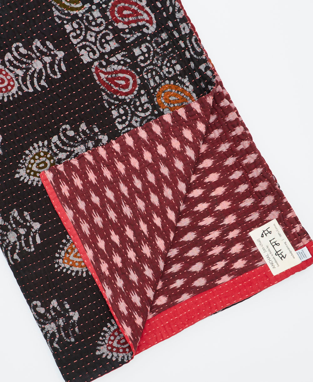 Kantha quilt throw featuring traditional kantha hand stitching