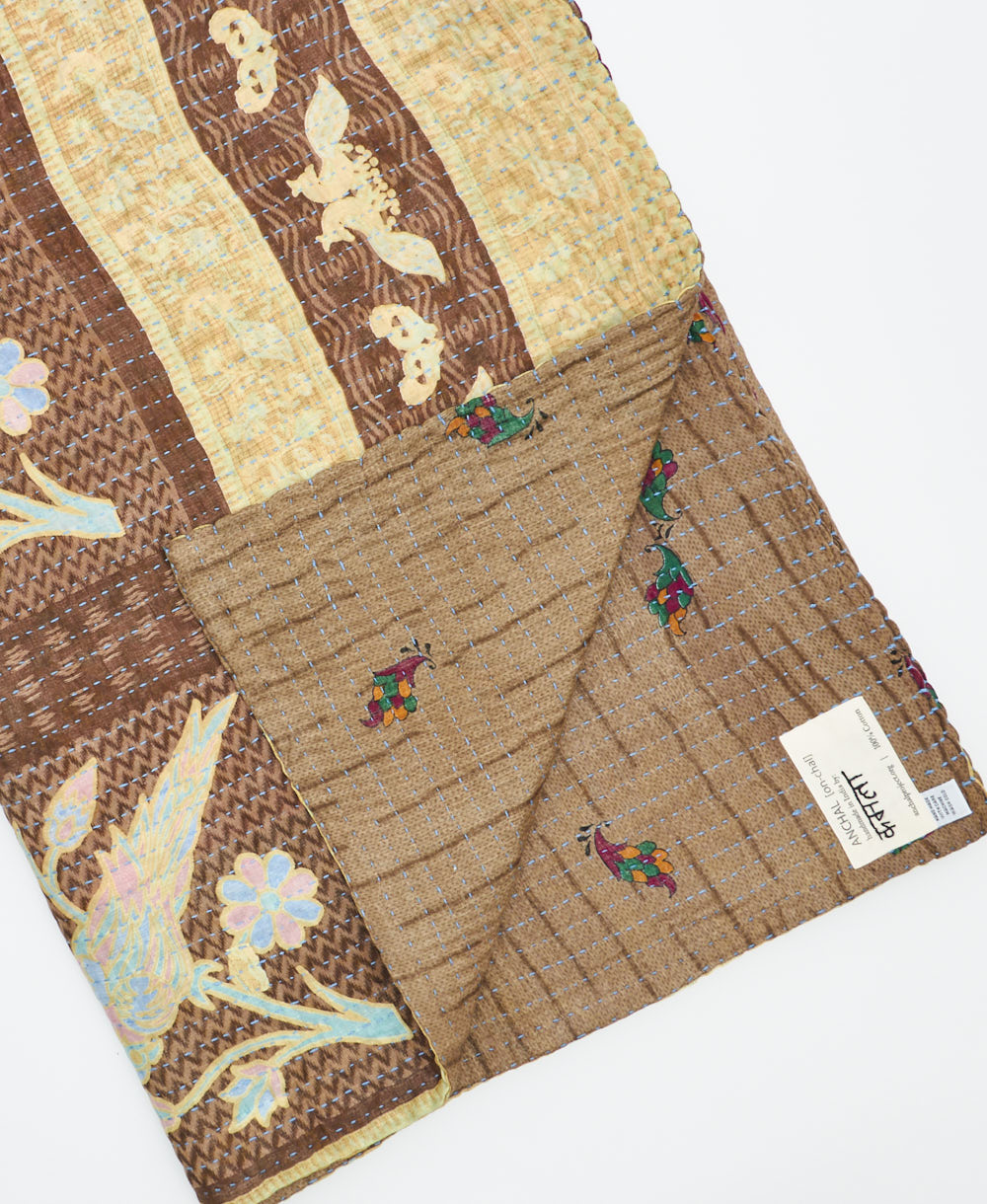 Kantha quilt throw featuring traditional kantha hand stitching