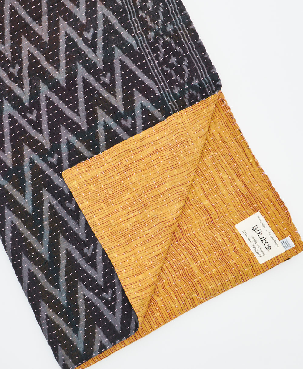 Kantha quilt throw featuring traditional kantha hand stitching