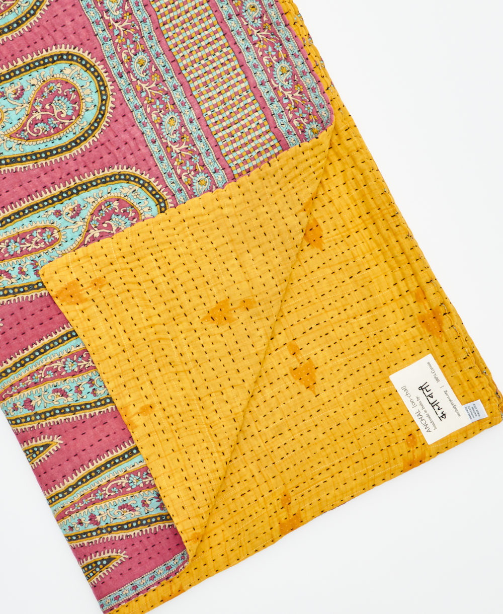 Kantha quilt throw featuring traditional kantha hand stitching