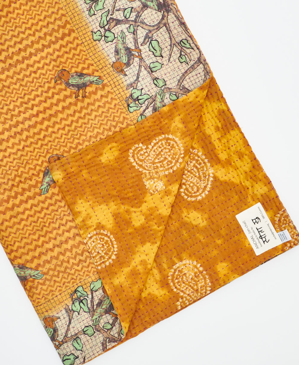 Kantha quilt throw featuring traditional kantha hand stitching