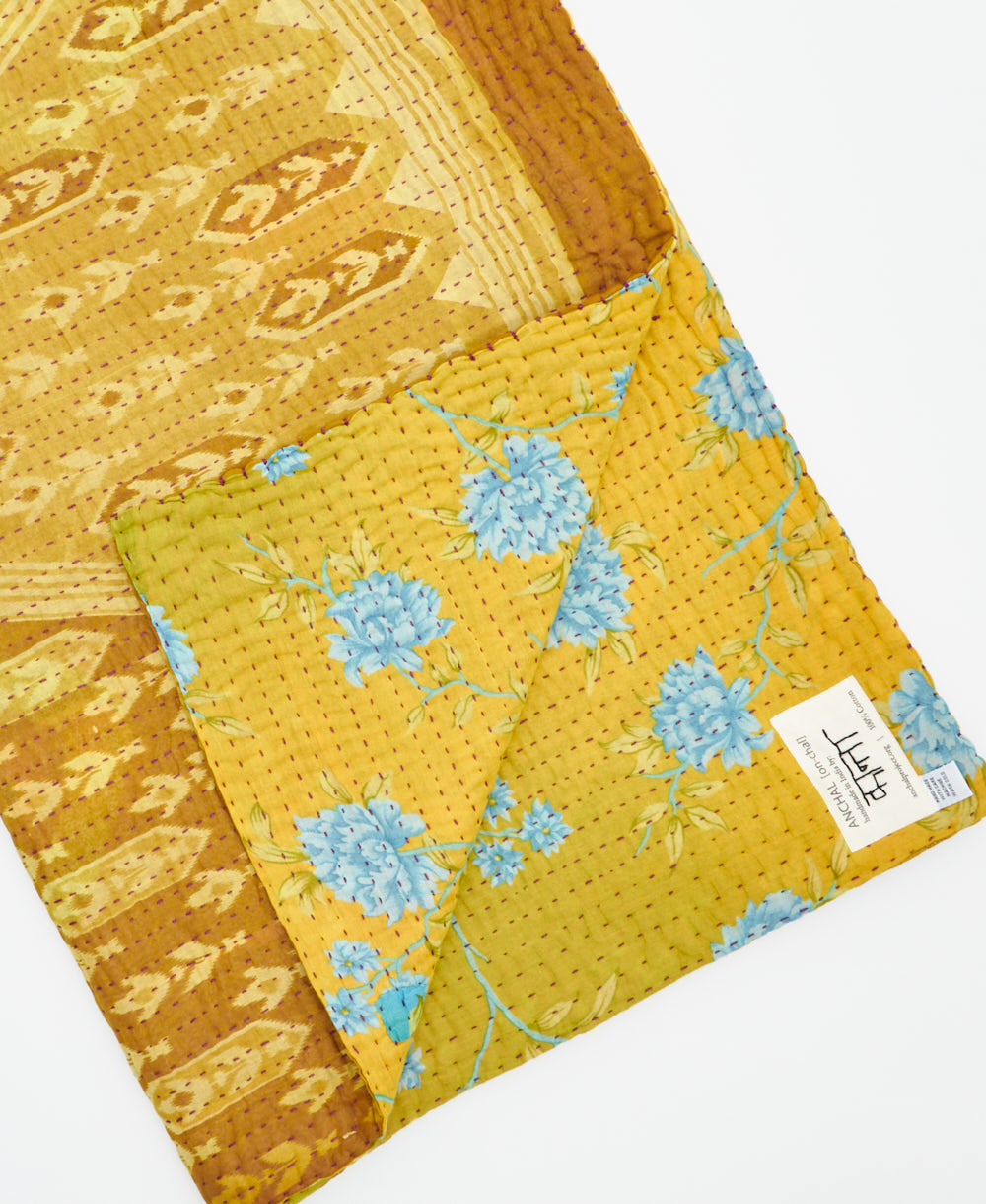 Kantha quilt throw featuring traditional kantha hand stitching