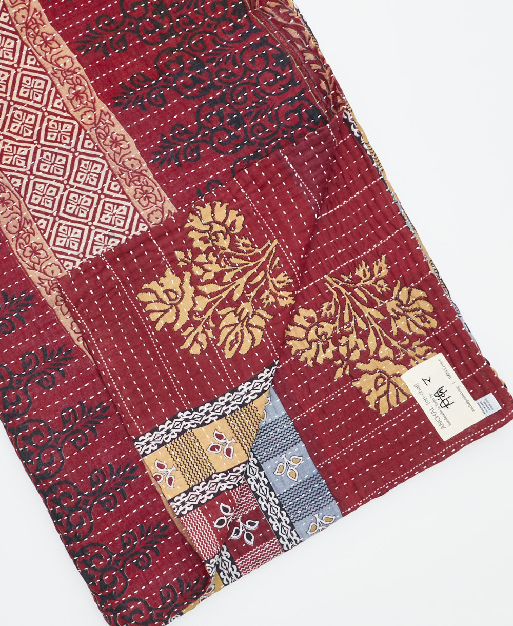 Kantha quilt throw featuring traditional kantha hand stitching