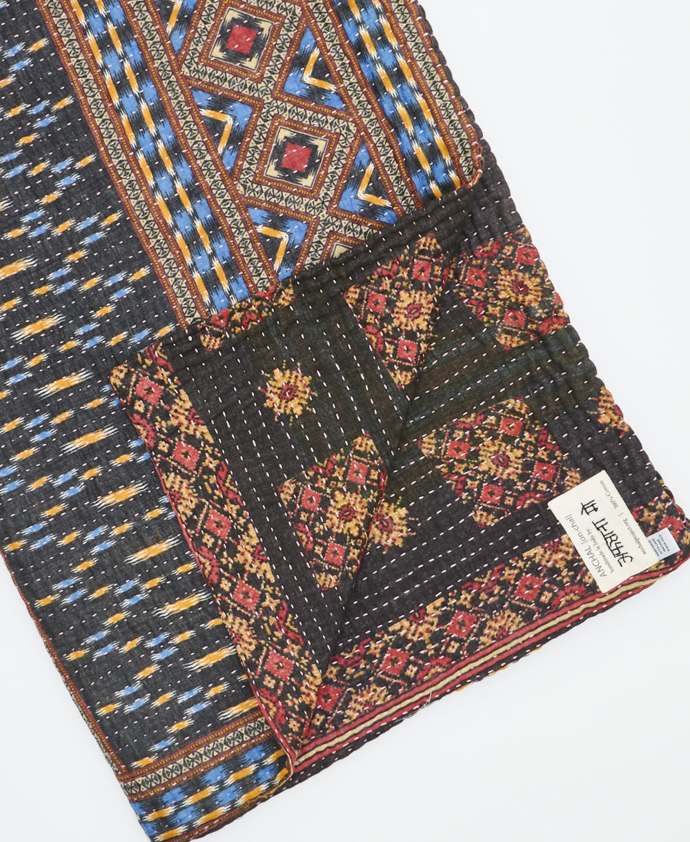 Kantha quilt throw featuring traditional kantha hand stitching