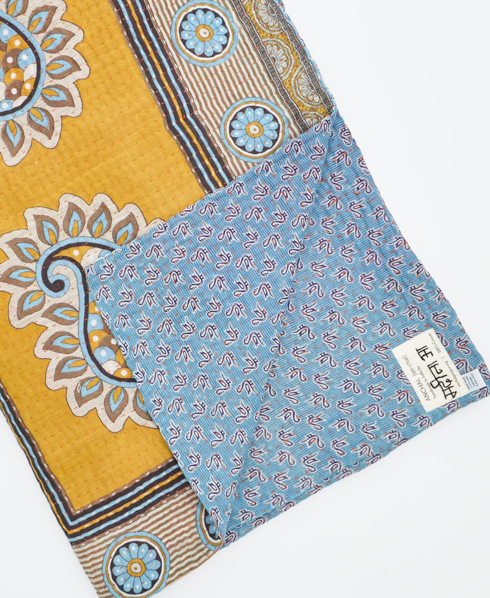 Kantha quilt throw featuring traditional kantha hand stitching