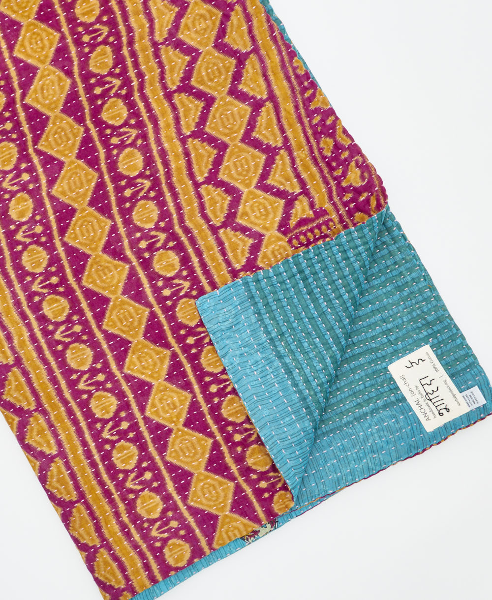 Kantha quilt throw featuring traditional kantha hand stitching