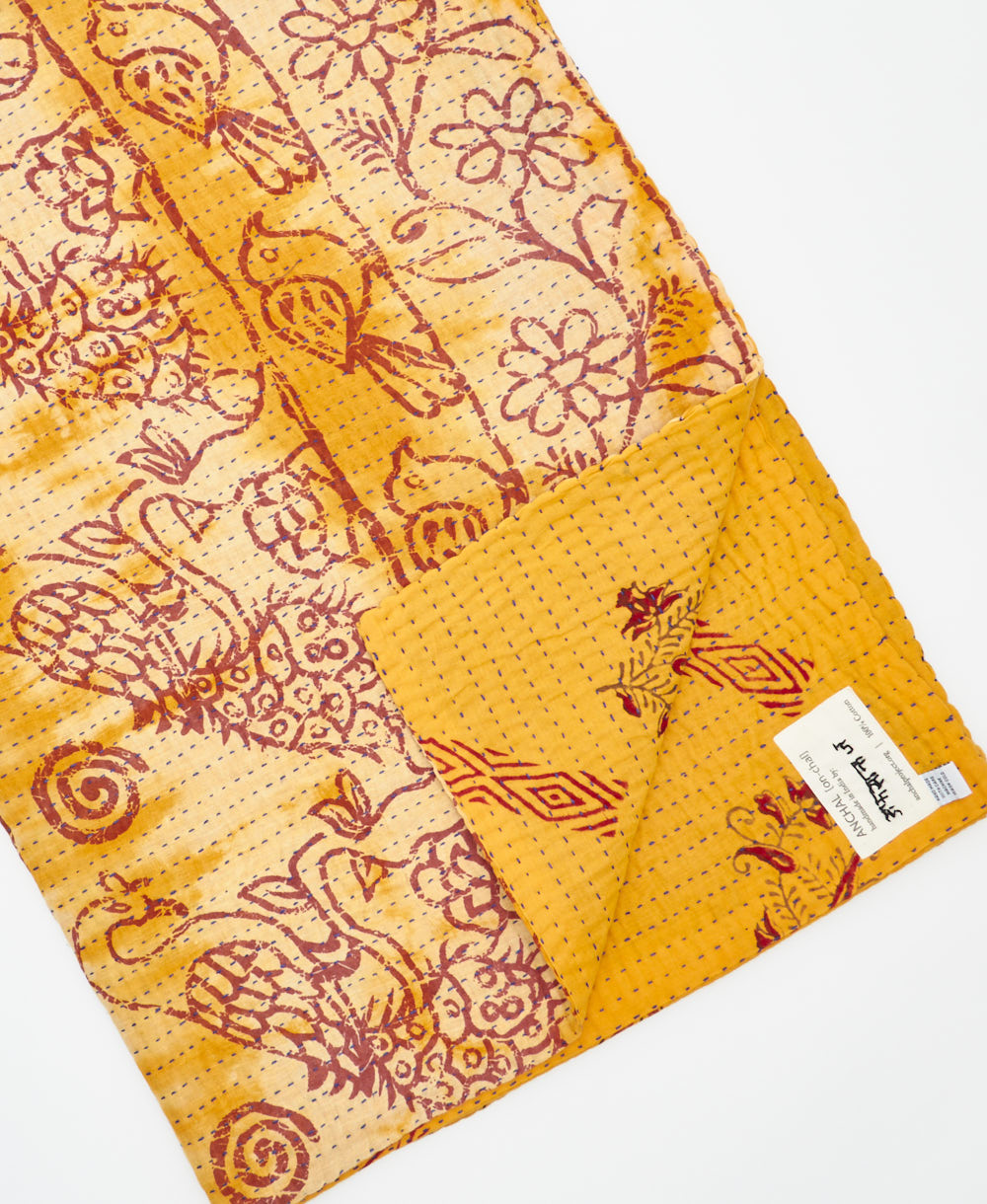 Kantha quilt throw featuring traditional kantha hand stitching
