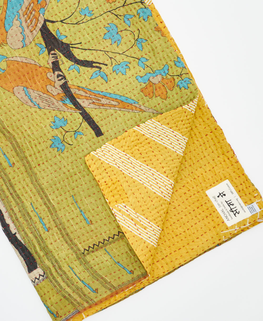 Kantha quilt throw featuring traditional kantha hand stitching