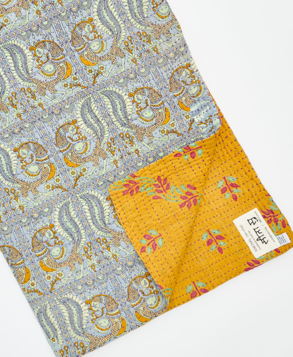 Kantha quilt throw featuring traditional kantha hand stitching