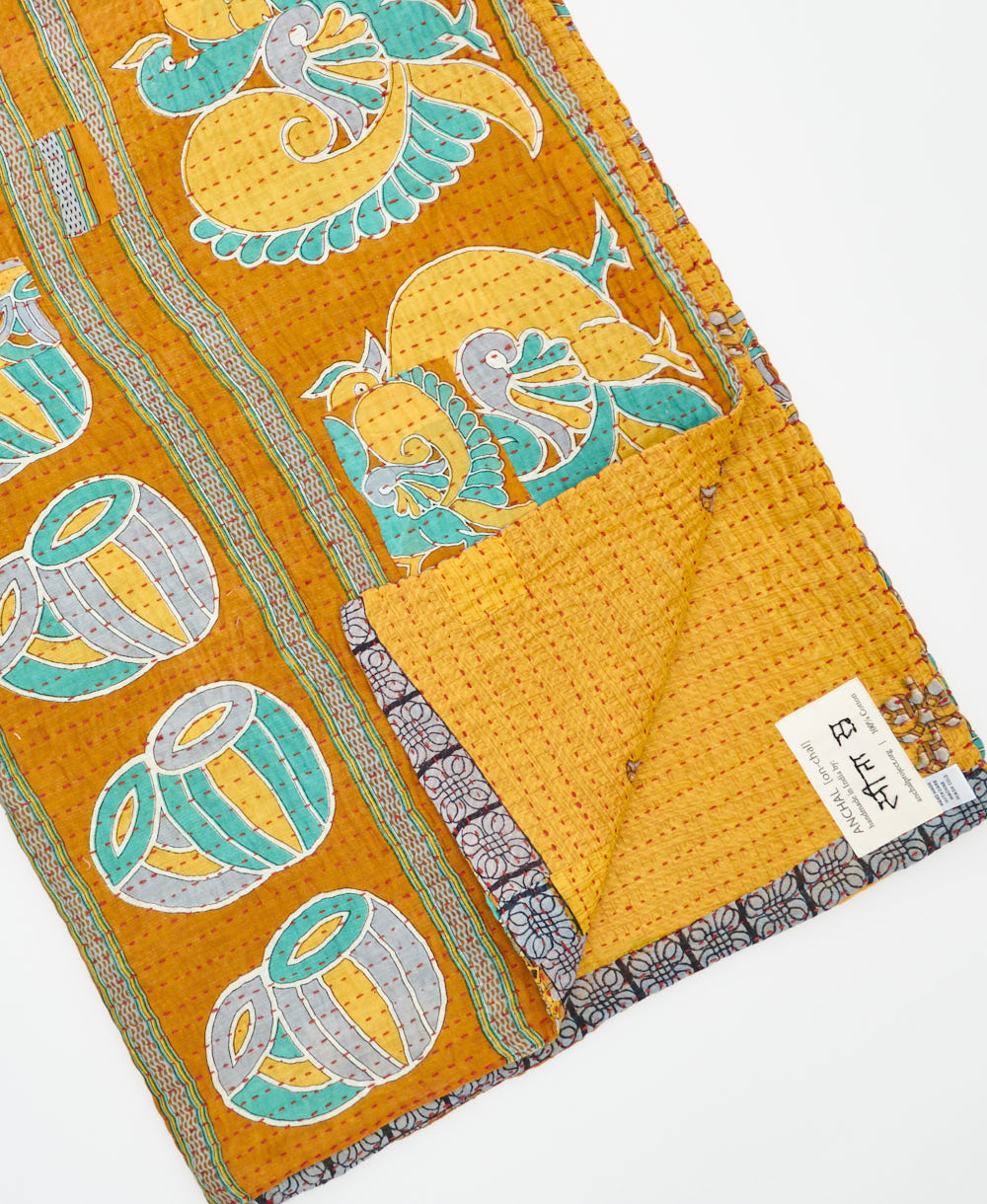 Kantha quilt throw featuring traditional kantha hand stitching