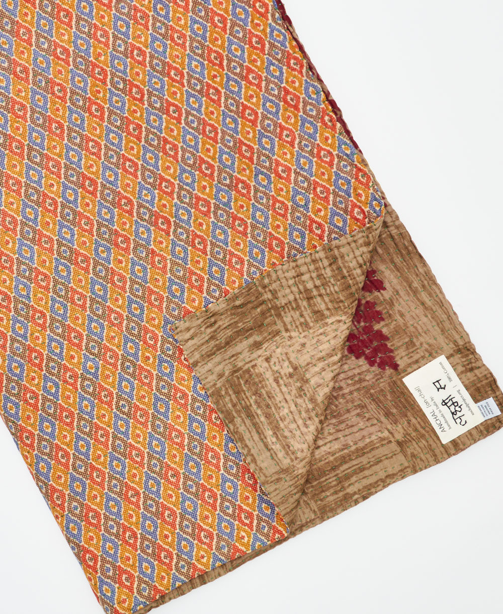 Kantha quilt throw featuring traditional kantha hand stitching